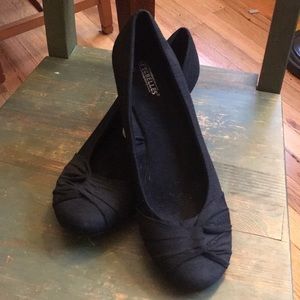 Black wedge slip-ons by Seychelles.